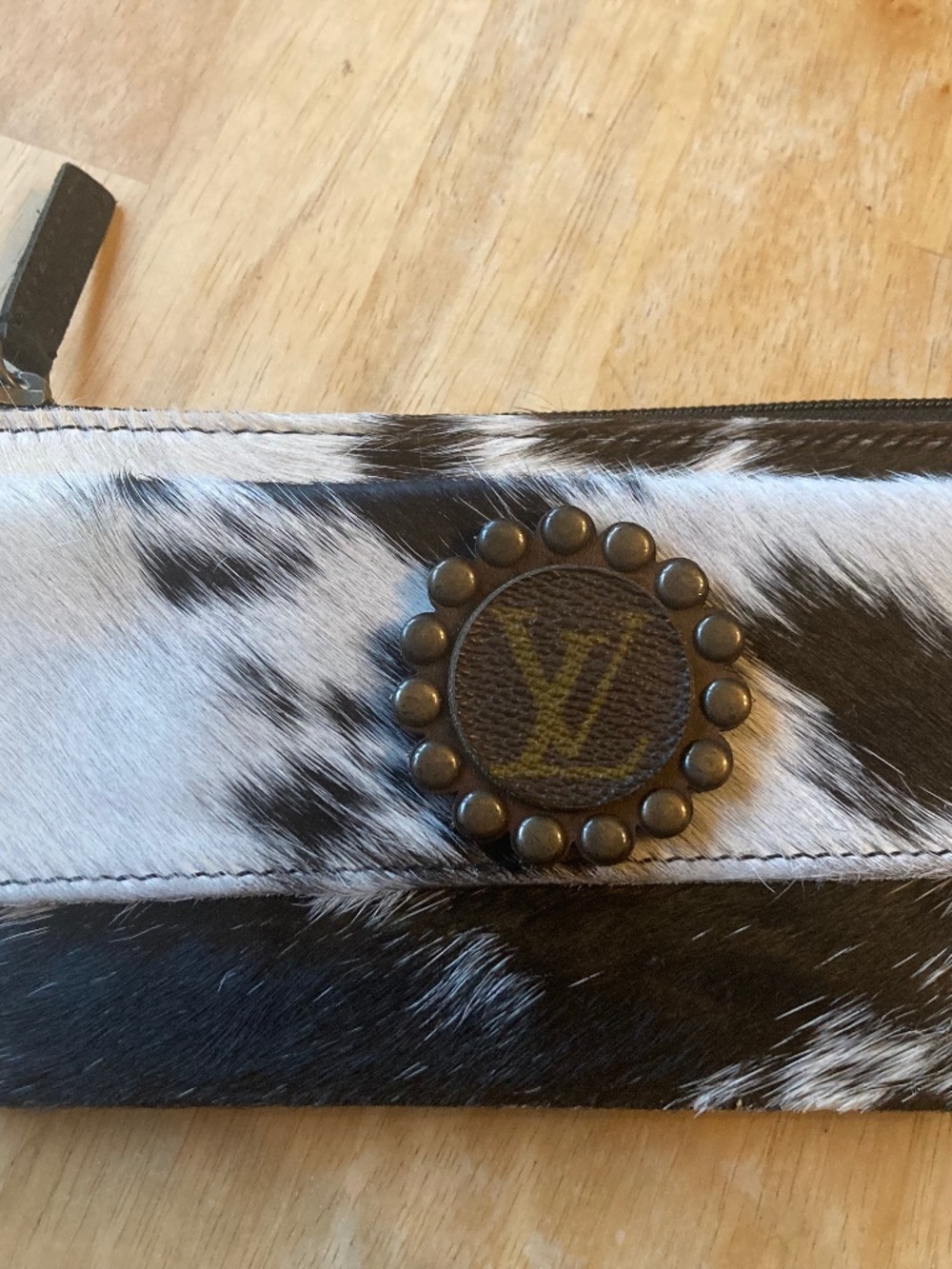 Cowhide wristlet upcylced Louis Vuitton